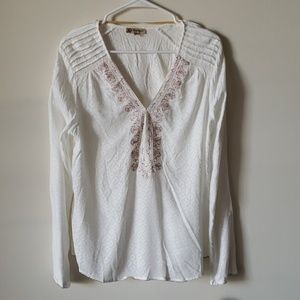 White shirt with colorful embroidery